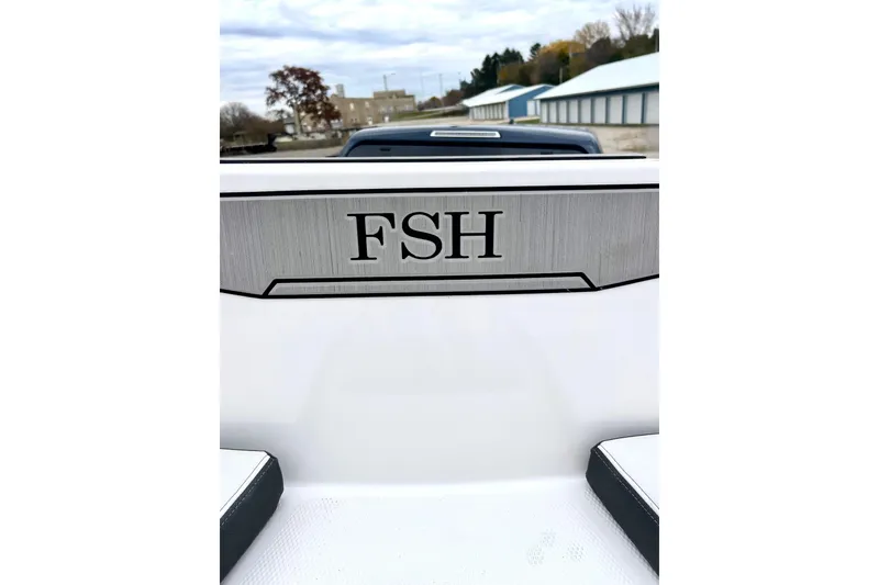 Slide: The Image of 2022 Yamaha Boats 255 FSH Sport H, close-up of FSH logo on boat interior. - 54