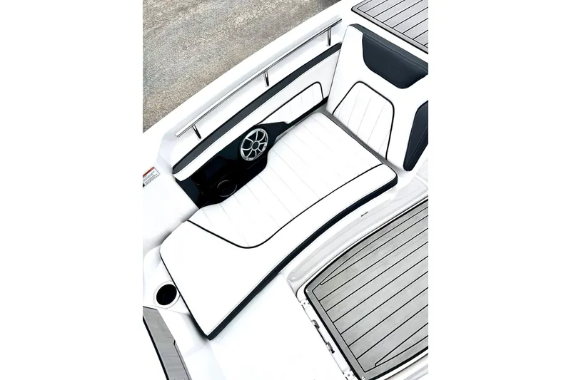 Slide: The Image of 2022 Yamaha Boats 255 FSH Sport H interior seating with sleek white and black design. - 56