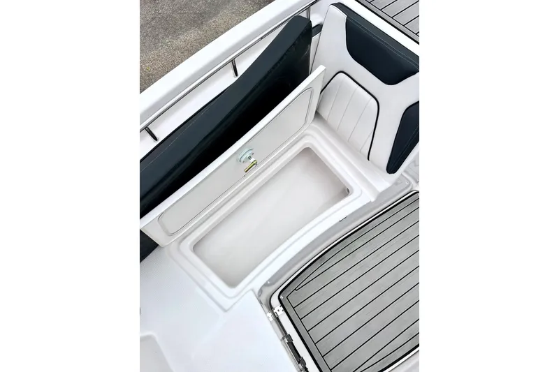 Slide: The Image of 2022 Yamaha Boats 255 FSH Sport H interior storage compartment, featuring sleek design and ample space. - 57