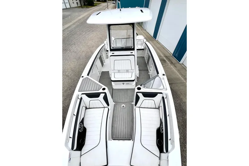Slide: The Image of 2022 Yamaha Boats 255 FSH Sport H, sleek white interior, spacious seating, modern design. - 60