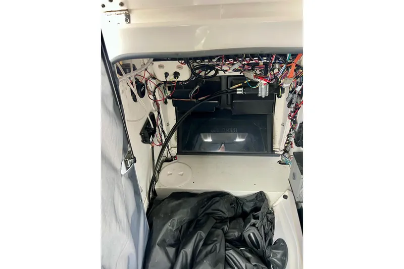 Slide: The Image of Interior wiring of 2022 Yamaha Boats 255 FSH Sport H, showcasing complex electrical setup. - 64