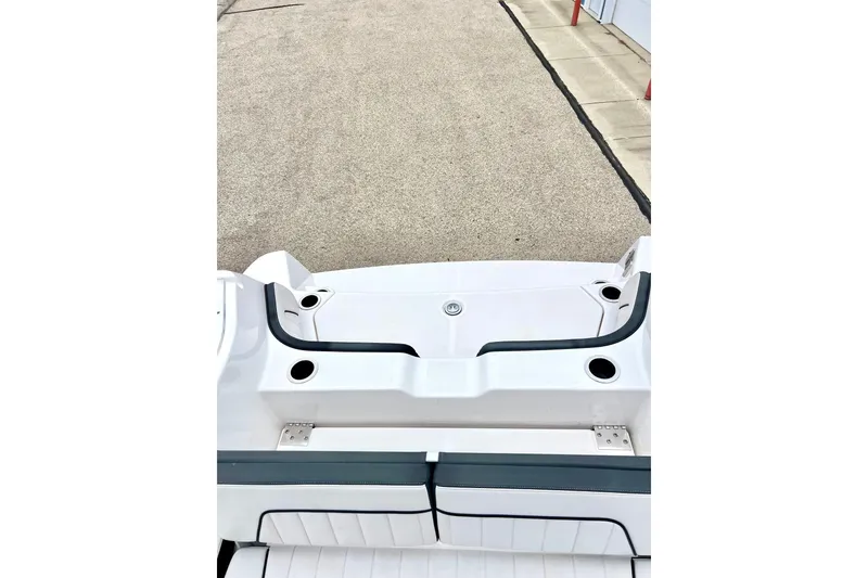 Slide: The Image of 2022 Yamaha Boats 255 FSH Sport H, rear deck view with seating and cup holders. - 72