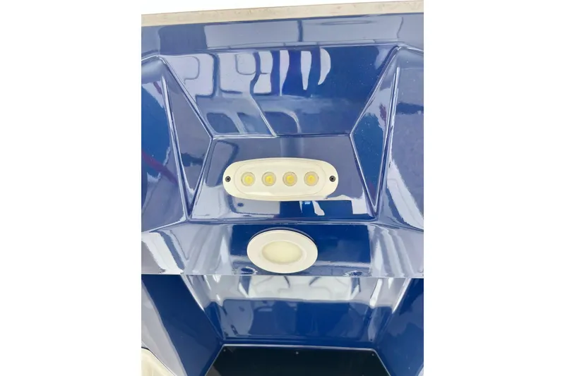 Slide: The Image of Blue interior detail of 2022 Yamaha Boats 255 FSH Sport H with LED lights. - 77