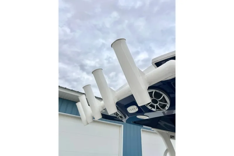 Slide: The Image of 2022 Yamaha Boats 255 FSH Sport H, rod holders and speaker detail. - 78