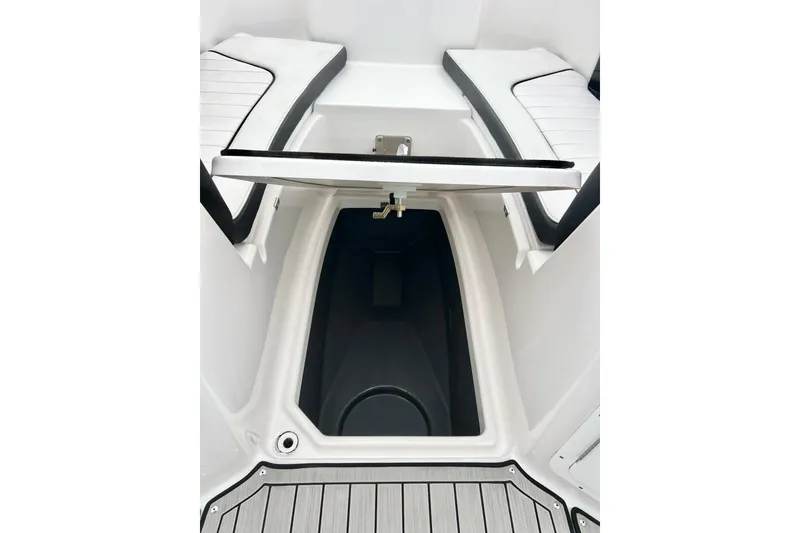 Slide: The Image of 2022 Yamaha Boats 255 FSH Sport H storage compartment with sleek seating design. - 80