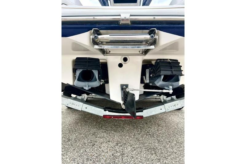 Slide: The Image of 2022 Yamaha Boats 255 FSH Sport H rear view, showcasing dual jet propulsion system. - 9