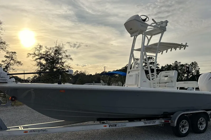 The Image of 2020 Pathfinder 2600 HPS boat on trailer at sunset, showcasing sleek design. - 0