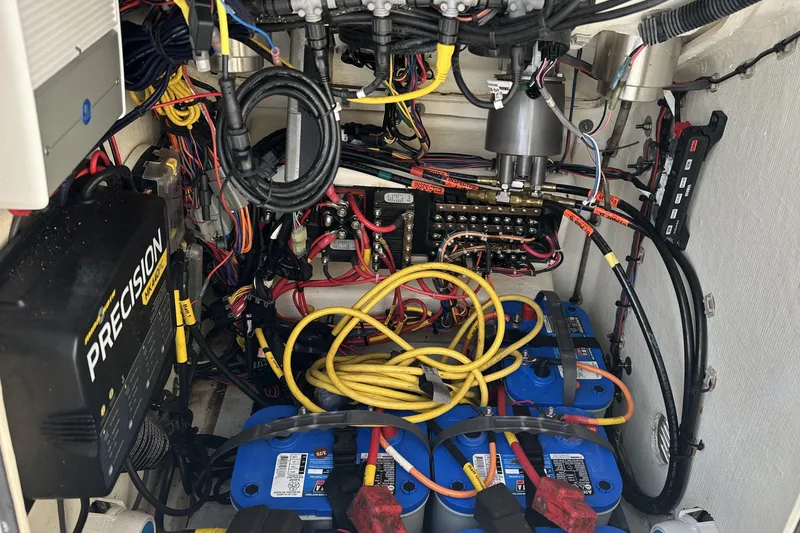 Slide: The Image of Electrical wiring and battery setup in a 2020 Pathfinder 2600 HPS boat. - 12