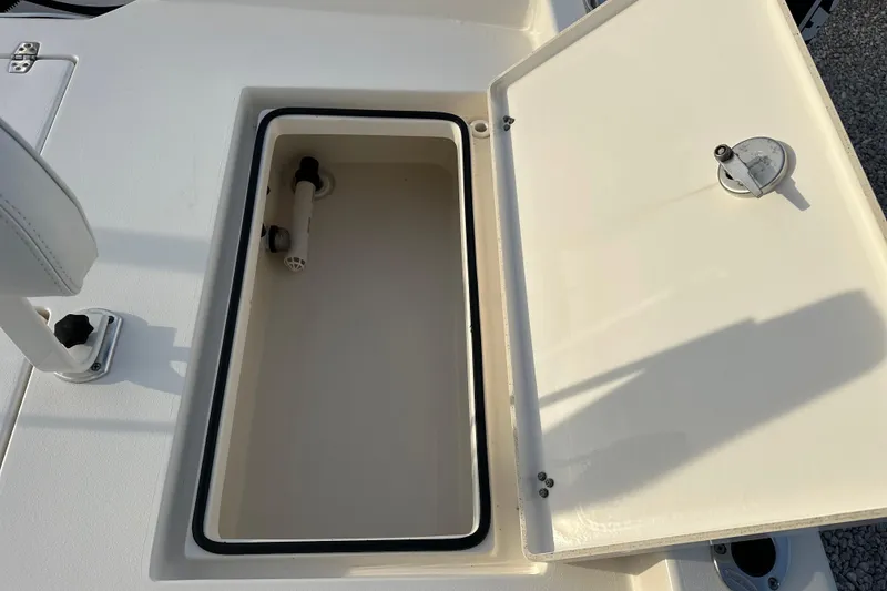 Slide: The Image of Open storage compartment on a 2020 Pathfinder 2600 HPS boat. - 13