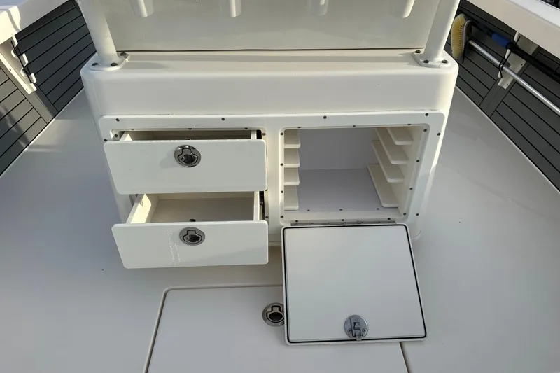 Slide: The Image of Pathfinder 2600 HPS 2020 boat storage compartments with open drawers and shelves. - 14