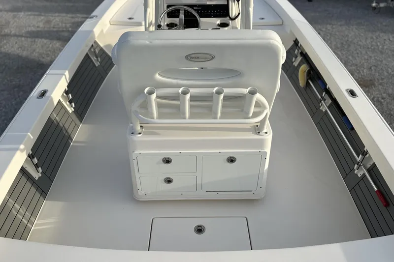Slide: The Image of 2020 Pathfinder 2600 HPS boat interior with rod holders and storage compartments. - 16