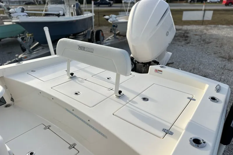 Slide: The Image of 2020 Pathfinder 2600 HPS boat with Yamaha outboard motor, docked on gravel. - 17