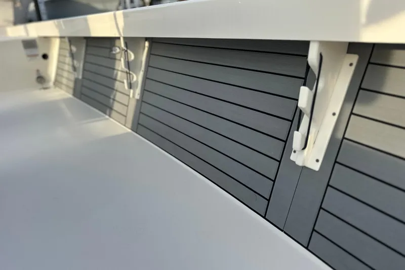 Slide: The Image of 2020 Pathfinder 2600 HPS boat interior with sleek, modern paneling and fixtures. - 19