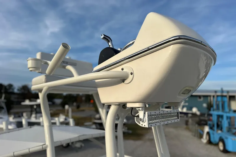 Slide: The Image of 2020 Pathfinder 2600 HPS boat console with steering wheel, outdoor setting. - 23