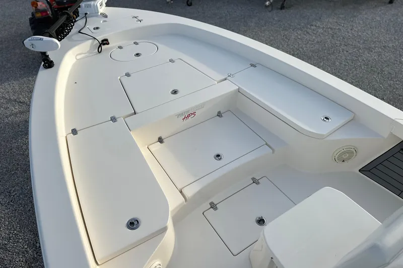 Slide: The Image of 2020 Pathfinder 2600 HPS boat deck with storage compartments and fishing equipment. - 25