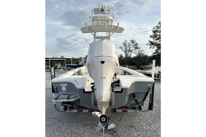 Slide: The Image of 2020 Pathfinder 2600 HPS boat, rear view with outboard motor, parked on gravel. - 7