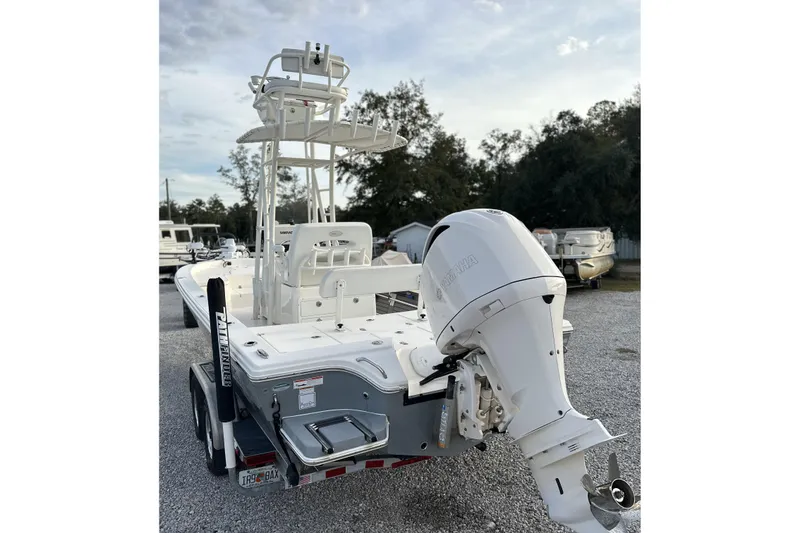 Slide: The Image of 2020 Pathfinder 2600 HPS boat with Yamaha outboard motor, parked on a trailer. - 8