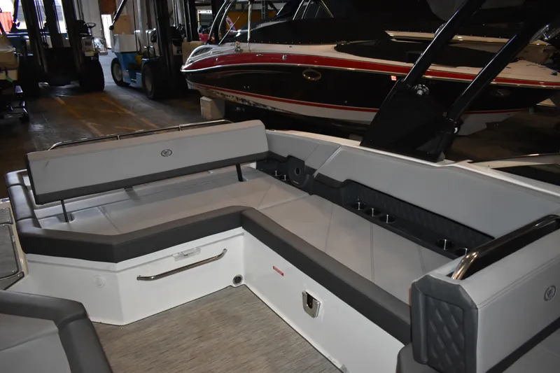 Slide: The Image of 2023 Cobalt R8 boat interior with sleek gray seating and modern design. - 19