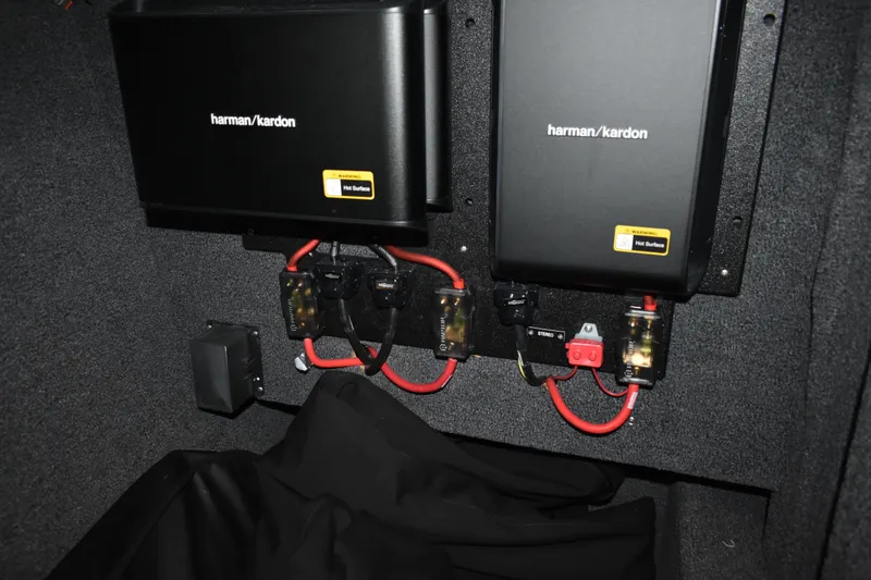 Slide: The Image of Open storage compartment in 2023 Cobalt R8 boat, showing interior and equipment. - 26