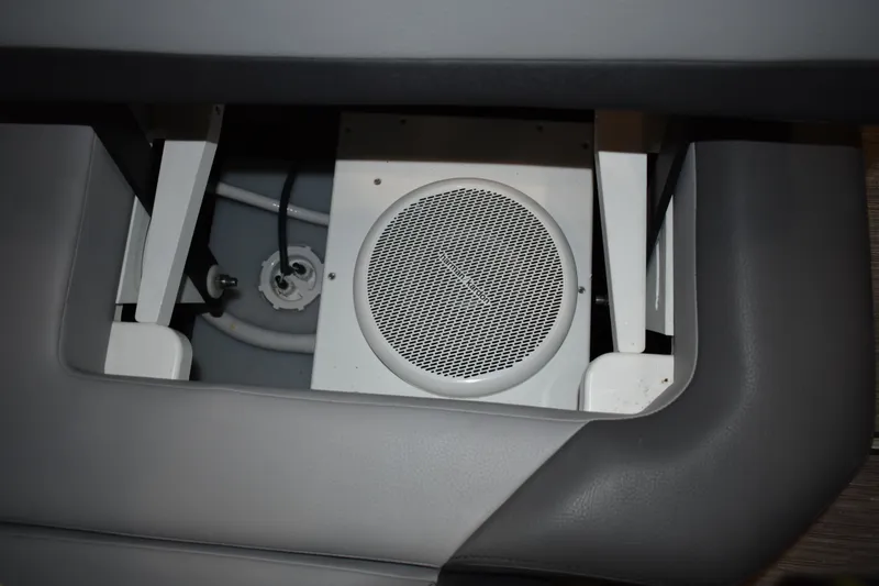 Slide: The Image of 2023 Cobalt R8 boat interior with open storage compartment and seating. - 27