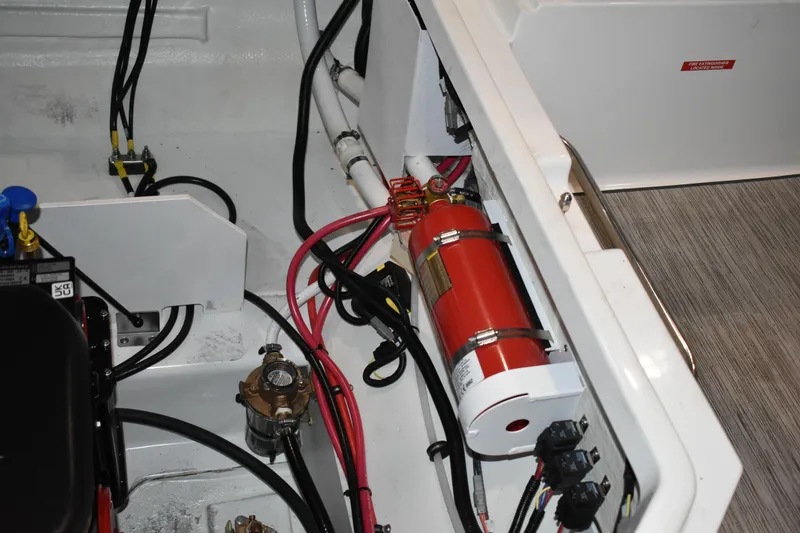 Slide: The Image of 2023 Cobalt R8 boat interior showing speaker and wiring components. - 29
