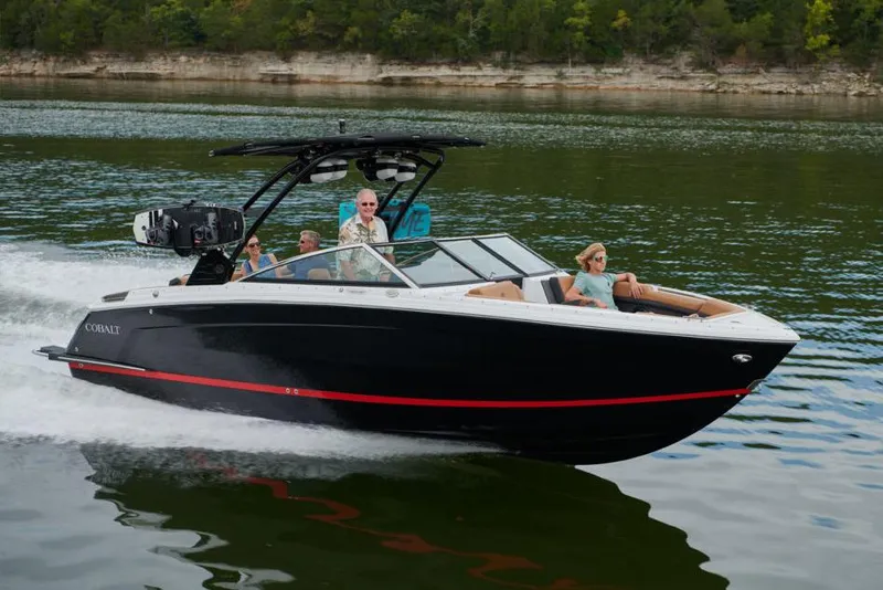 Slide: The Image of 2023 Cobalt R8 boat with Volvo Penta outdrive and propeller in a garage setting. - 34