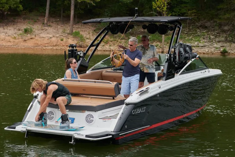 Slide: The Image of 2023 Cobalt R8 boat covered in storage, surrounded by other boats. - 5