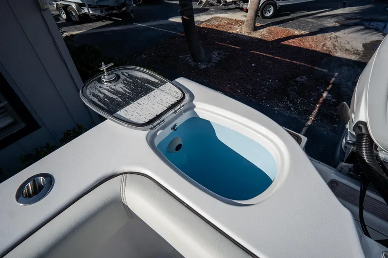 Slide: The Image of 2021 Tidewater 320 CC Adventure boat with dual engines and spacious seating area. - 11