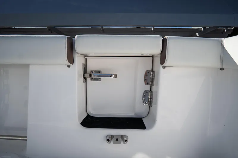 Slide: The Image of 2021 Tidewater 320 CC Adventure boat deck with dual Mercury engines. - 12