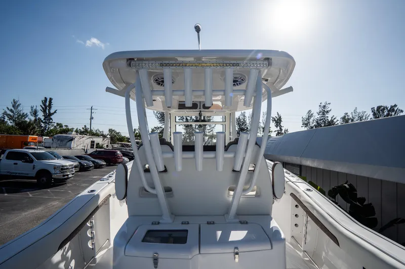 Slide: The Image of Open hatch on 2021 Tidewater 320 CC Adventure boat, dockside view. - 14