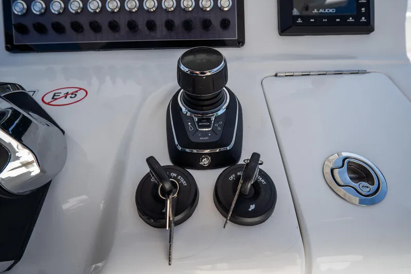 Slide: The Image of 2021 Tidewater 320 CC Adventure boat helm with Garmin navigation system. - 27