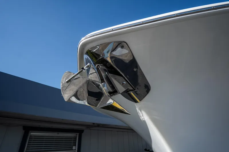 Slide: The Image of 2021 Tidewater 320 CC Adventure boat docked in a marina under clear skies. - 3