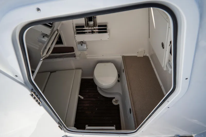 Slide: The Image of Control panel of 2021 Tidewater 320 CC Adventure boat with steering wheel and throttle. - 31