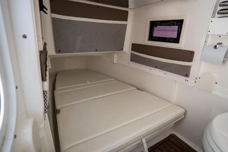 Slide: The Image of Garmin marine radio on 2021 Tidewater 320 CC Adventure boat dashboard. - 33