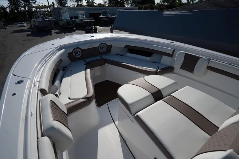 Slide: The Image of 2021 Tidewater 320 CC Adventure boat deck with branded mat and seating. - 35