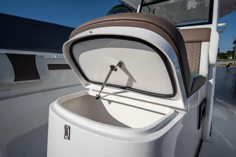 Slide: The Image of 2021 Tidewater 320 CC Adventure boat interior with seating and storage compartments. - 39