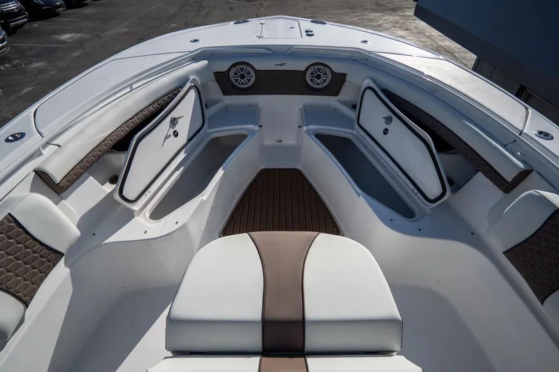 Slide: The Image of 2021 Tidewater 320 CC Adventure boat seats with armrests and cup holders. - 43