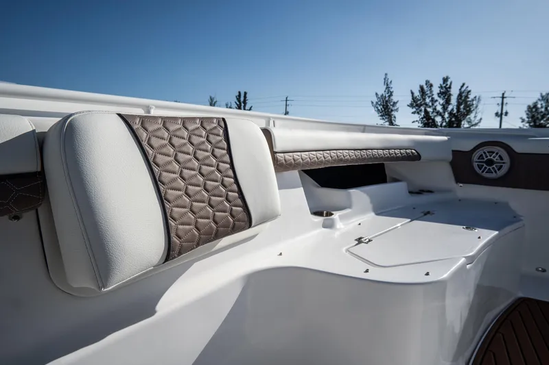 Slide: The Image of 2021 Tidewater 320 CC Adventure boat seat with dual cup holders and stylish stitching. - 45