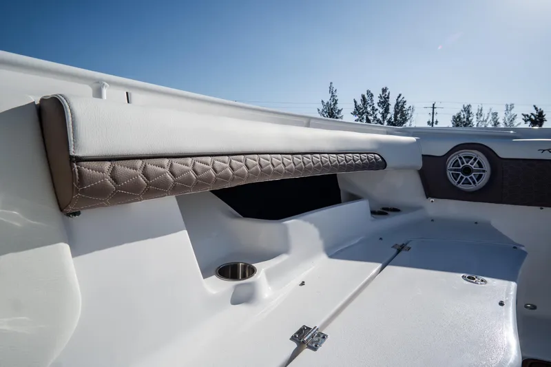 Slide: The Image of 2021 Tidewater 320 CC Adventure boat interior with cup holders and speaker. - 48