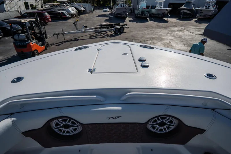 Slide: The Image of 2021 Tidewater 320 CC Adventure boat interior with luxurious seating and waterfront view. - 53