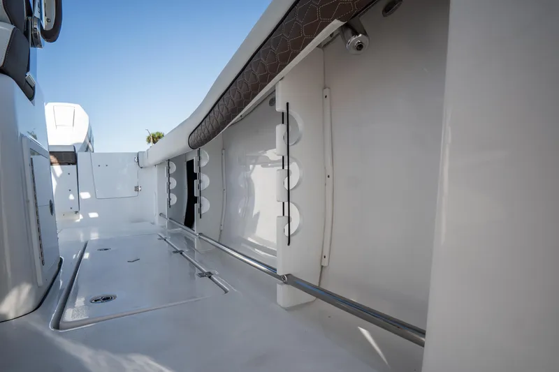 Slide: The Image of Anchor compartment of 2021 Tidewater 320 CC Adventure boat, featuring a neatly stored anchor. - 55