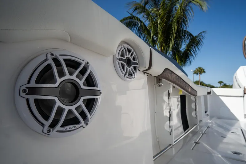 Slide: The Image of 2021 Tidewater 320 CC Adventure cabin interior with cushioned seating and storage compartments. - 57