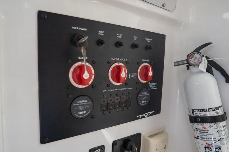 Slide: The Image of Control panel and fire extinguisher on 2021 Tidewater 320 CC Adventure boat. - 64