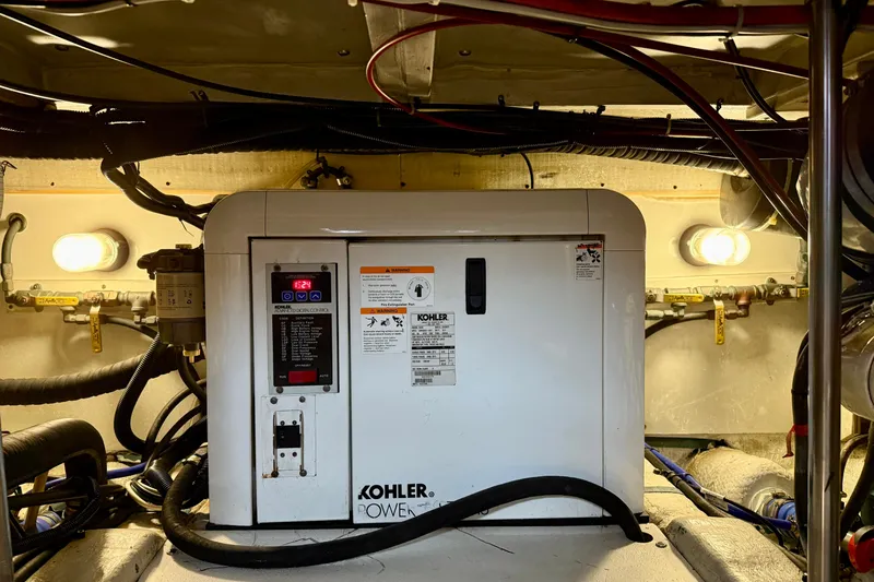 Slide: The Image of Engine room of 1996 Egg Harbor 35 Sport Fisherman with Kohler generator. - 13