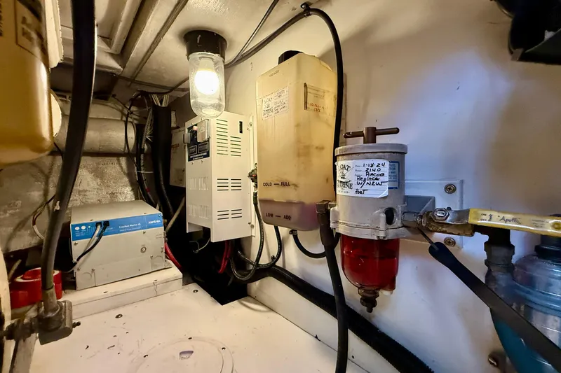 Slide: The Image of Engine room of 1996 Egg Harbor 35 Sport Fisherman with electrical and fuel systems. - 16