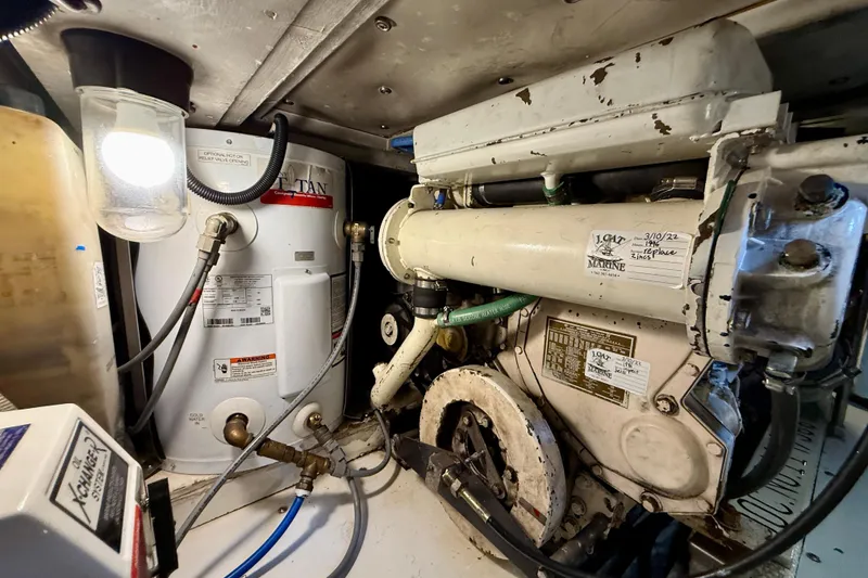 Slide: The Image of Engine room of 1996 Egg Harbor 35 Sport Fisherman with visible machinery and components. - 18