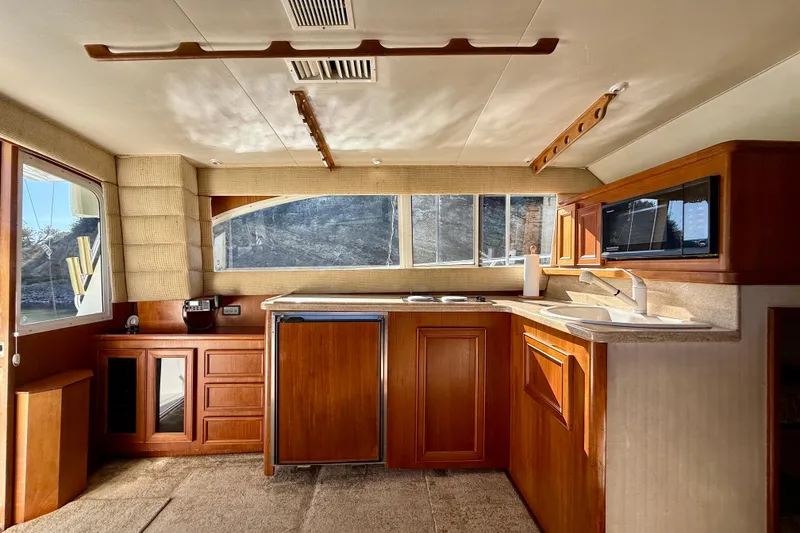 Slide: The Image of Interior of 1996 Egg Harbor 35 Sport Fisherman yacht with wooden cabinetry and modern amenities. - 20