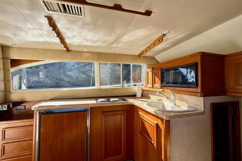 Slide: The Image of Interior of 1996 Egg Harbor 35 Sport Fisherman yacht with wooden cabinetry and modern amenities. - 21