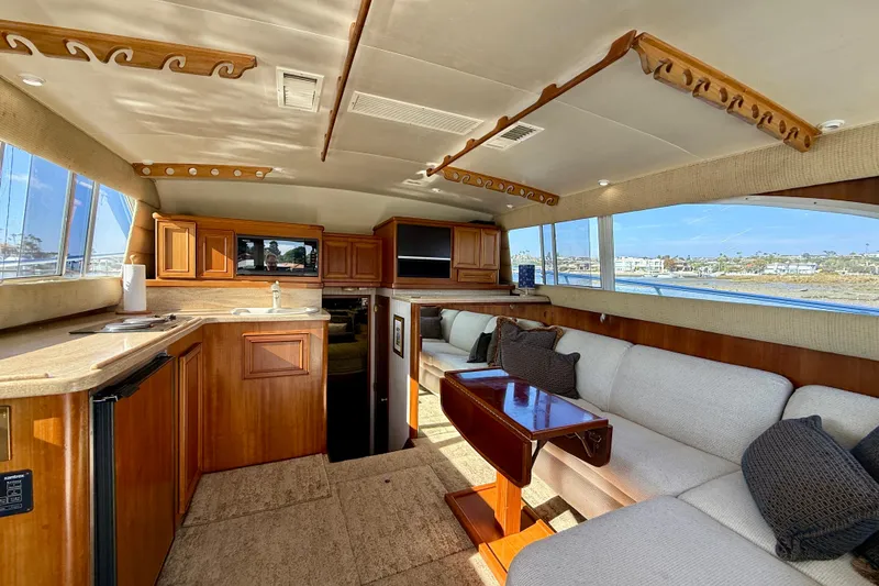 Slide: The Image of Interior of 1996 Egg Harbor 35 Sport Fisherman with wood cabinetry and plush seating. - 25