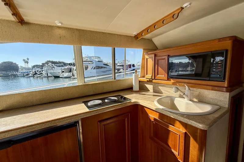 Slide: The Image of Interior of 1996 Egg Harbor 35 Sport Fisherman yacht kitchen with sink and microwave. - 27